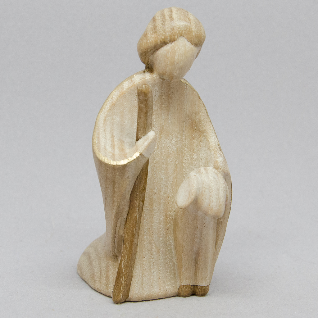 Hirte kniend mit Schaf